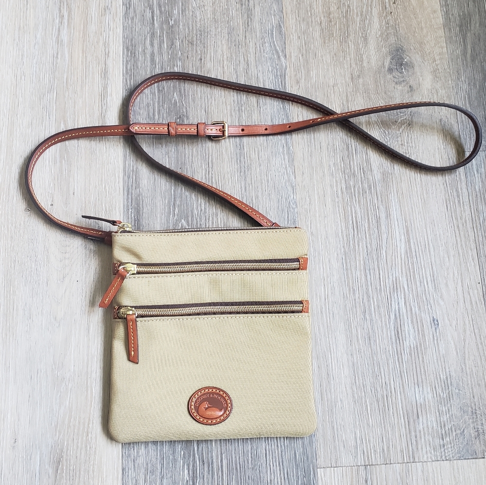 DOONEY & BOURKE INC.TRIPLE ZIP SLING BAG